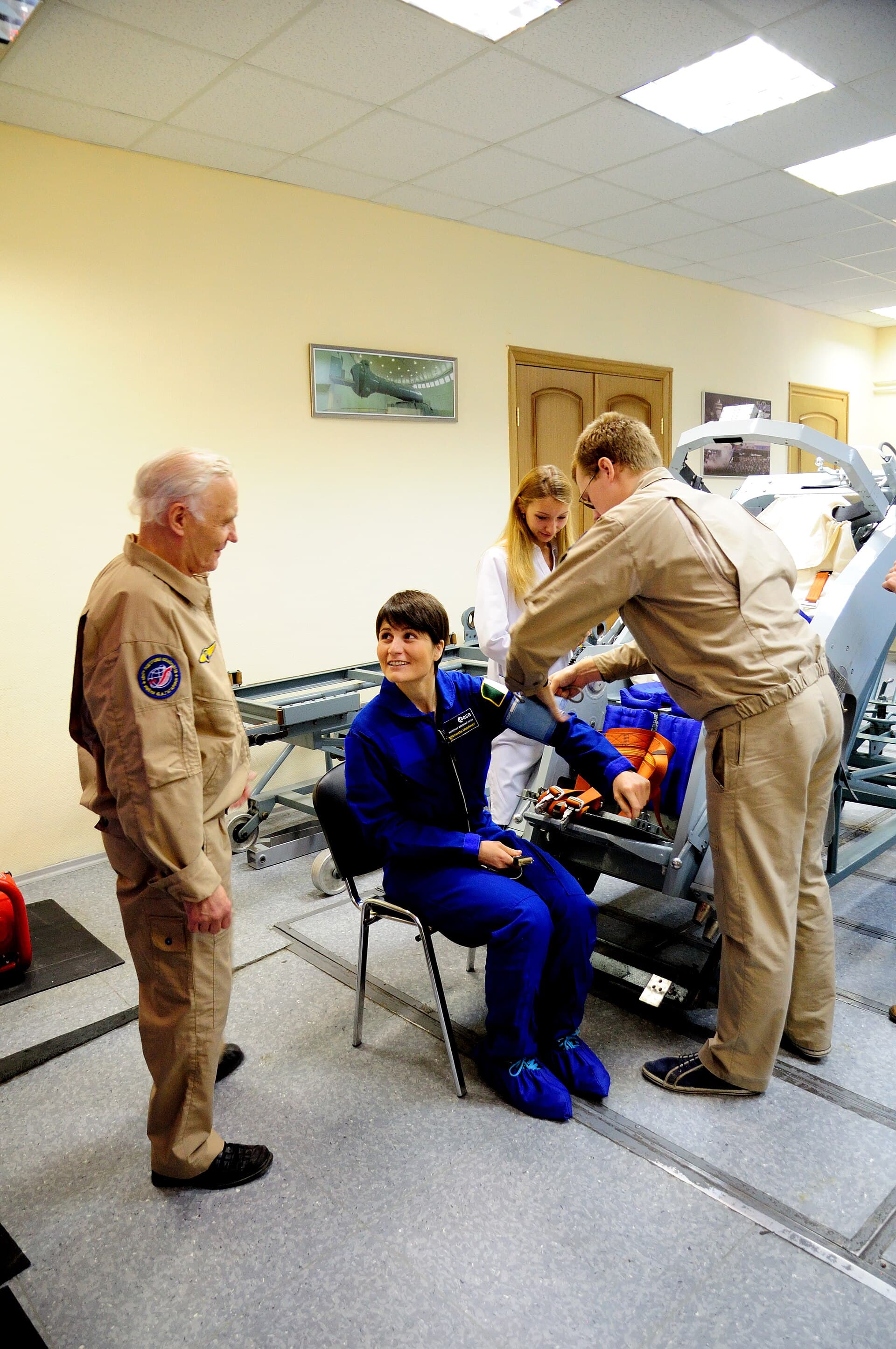 A blood pressure cuff being placed on a person's arm