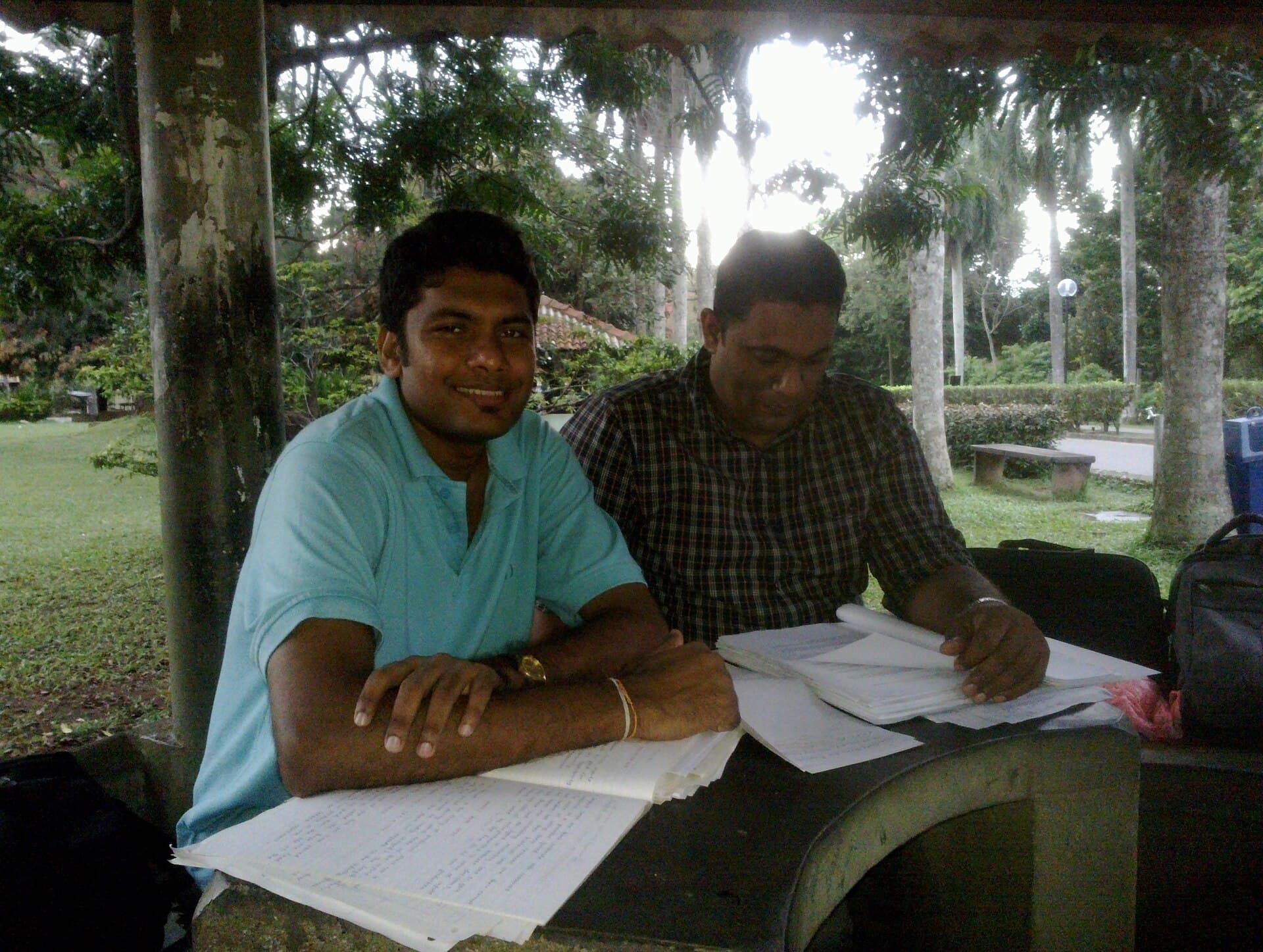 University students studying at desks before exams on a campus in Sri Lanka